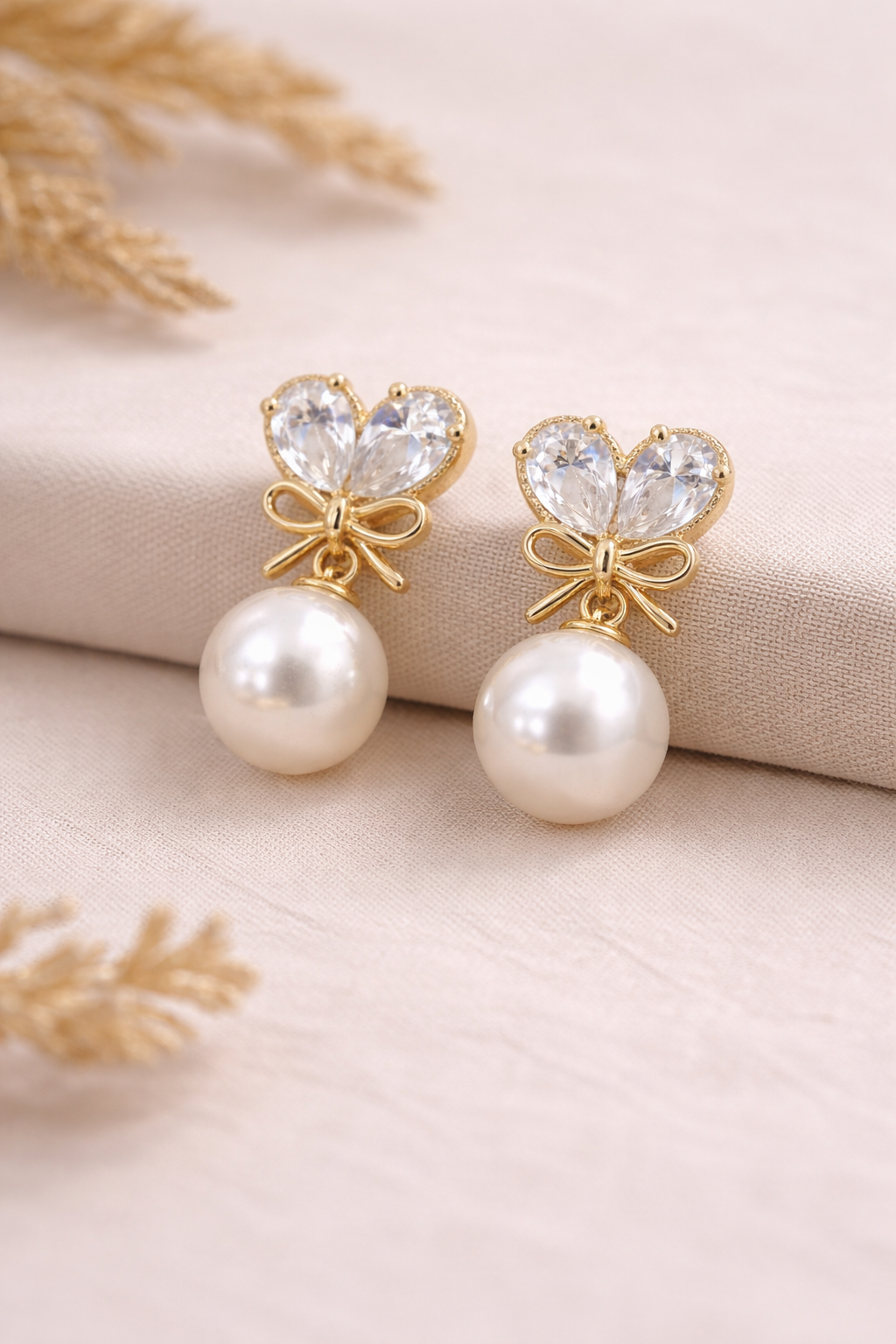 gold-bow-pearl-drop-earrings-1.png