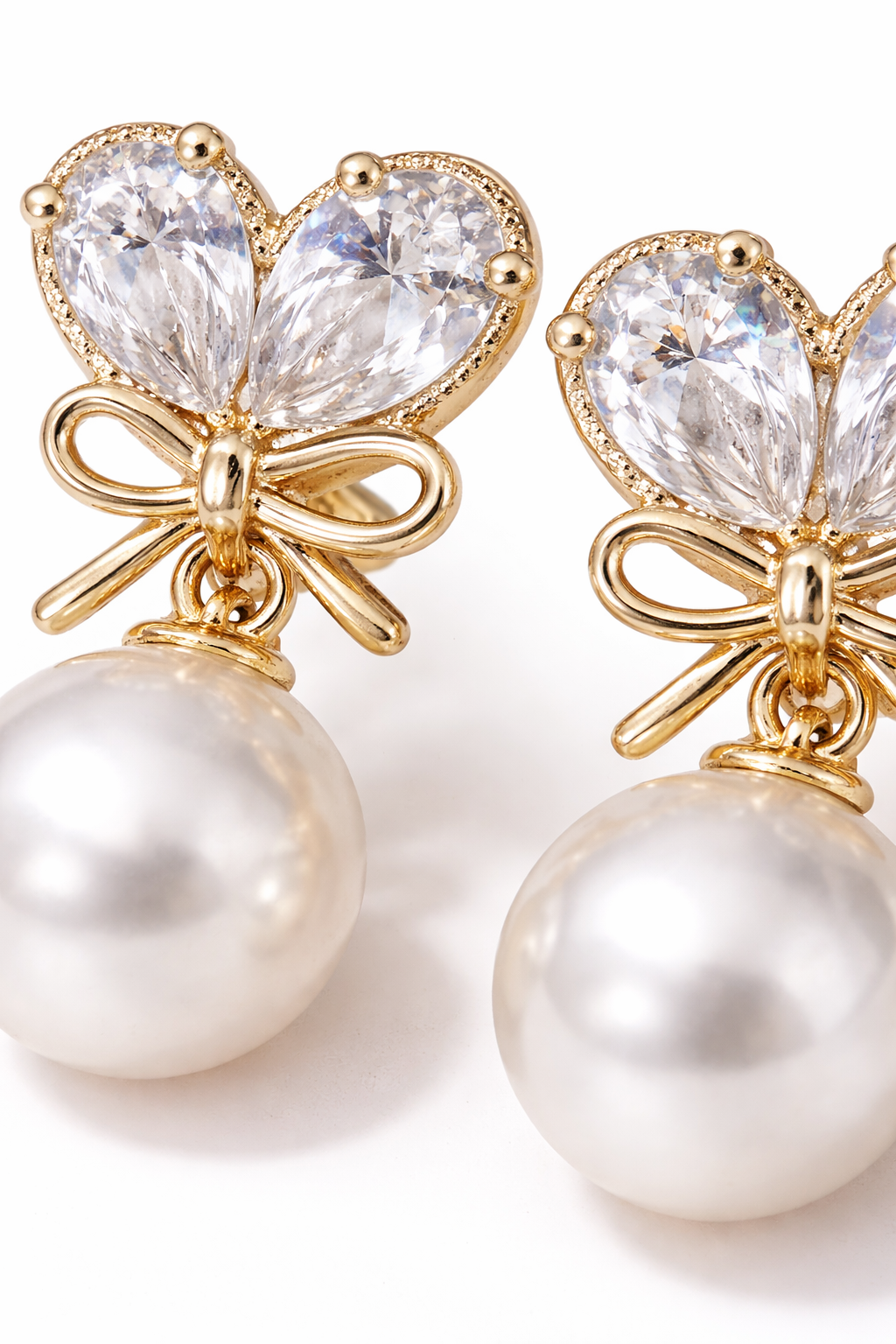 gold-bow-pearl-drop-earrings-2.png