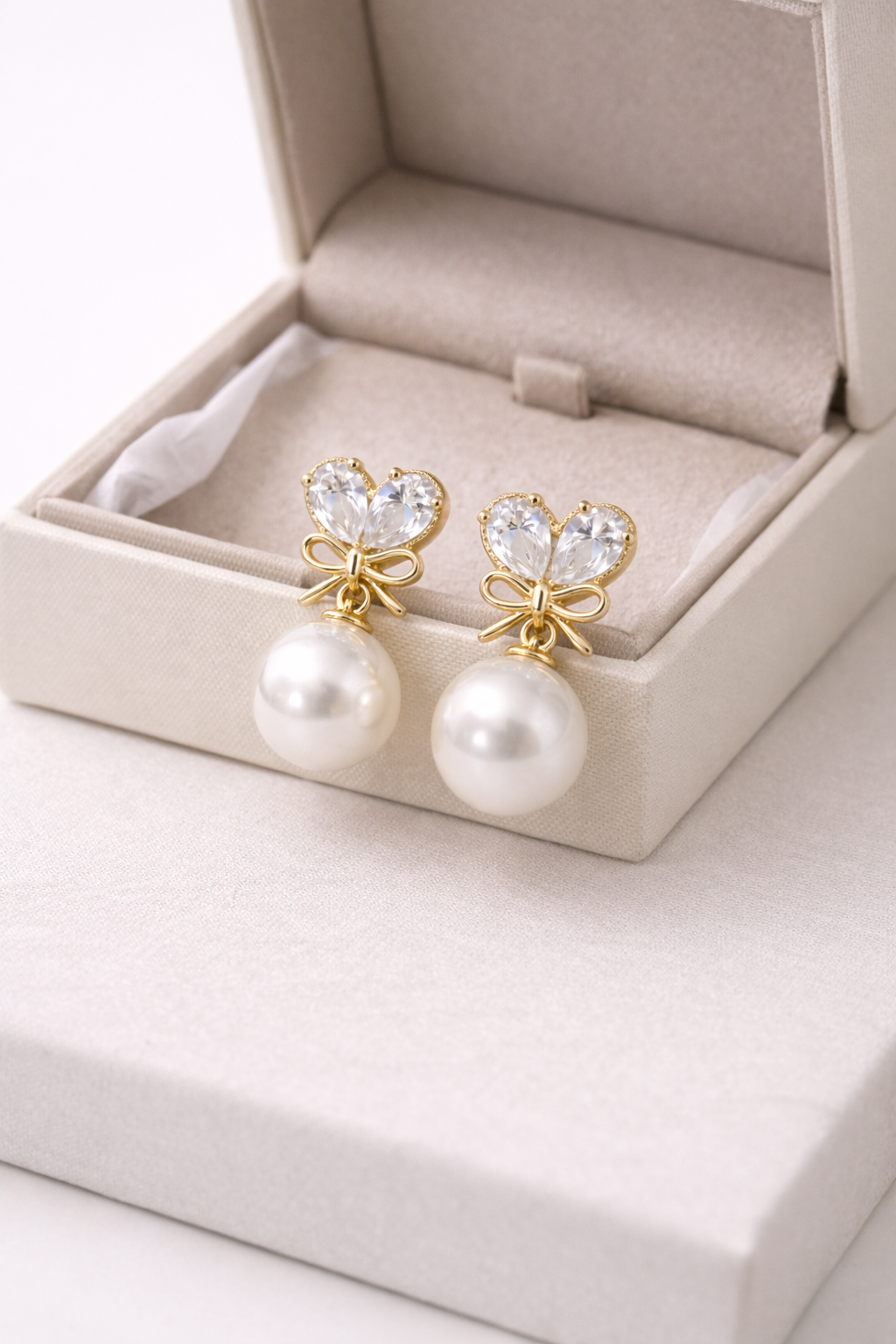 gold-bow-pearl-drop-earrings-3.png